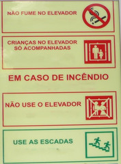 Hinweisschild in einem Aufzug #1 - elevador, criancas, acompanhadas, incêndio, escaleras