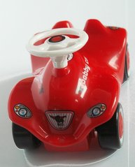 Ein Bobbycar - Physik, Geschwindigkeit, Bewegung, Bobbycar, Spielzeug, Fahrzeug, Lenkrad, rot